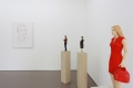 Stephan Balkenhol, Installation shot, Right side: Frau in rotem Kleid und mit roter Handtasche (Woman in red dress and with red handbag), 2013, Coloured wawa wood, 168 x 24 x 30 cm | 66.14 x 9.45 x 11.81 in, # BALK0004 